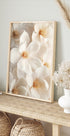 a picture of white flowers in a wooden frame